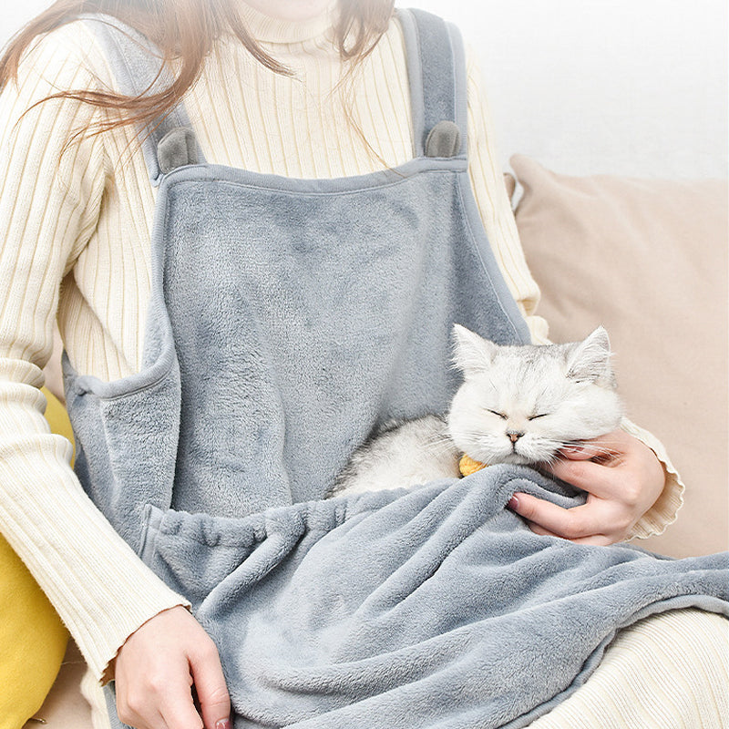 Cat carrier apron front view — cat tucked inside against chest