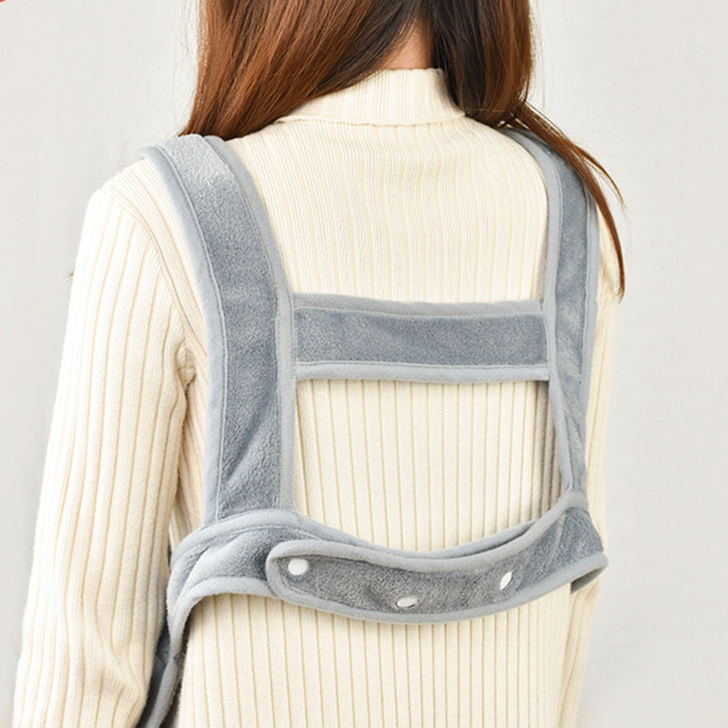 Cat mom wearing carrier apron — cat peeking out from chest pouch